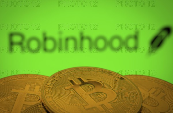 Dhaka, Bangladesh- 20 Sep 2025: Close-up of Bitcoin coins with the Robinhood Markets logo visible