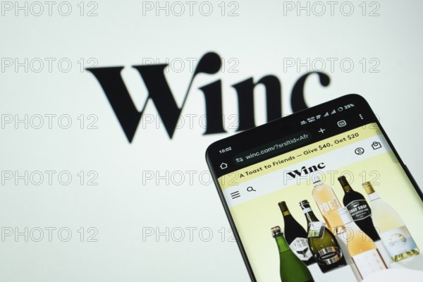 Dhaka, Bangladesh- 03 July 2025: Smartphone displaying Winc web interface against Winc logo