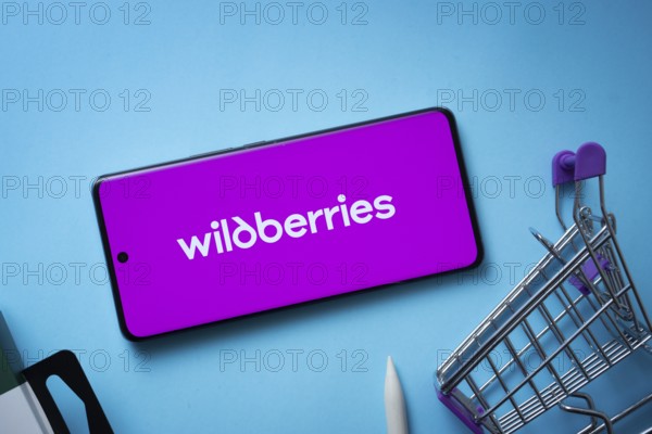 Dhaka, Bangladesh- 03 July 2025: Smartphone displaying Wildberries logo with shopping cart on a