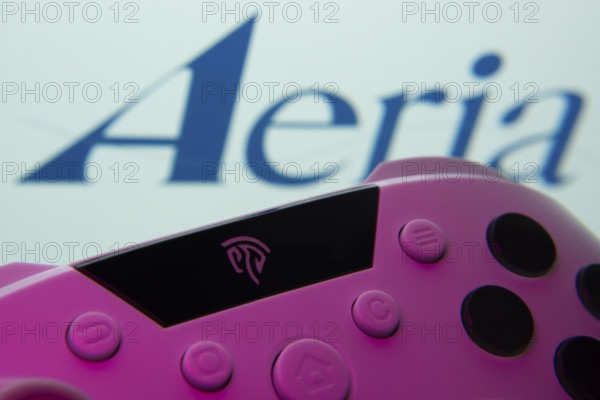 Dhaka, Bangladesh- 23 Sep 2025: A close-up of a gamepad with the Aeria seen on screen in the
