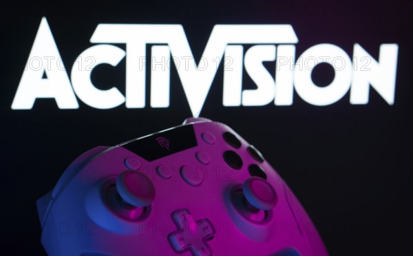 Dhaka, Bangladesh- 23 Sep 2025: A close-up of a white gamepad with the Activision seen on screen in