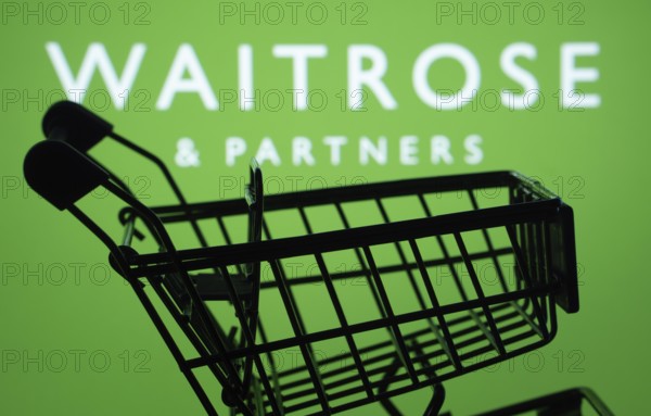 Dhaka, Bangladesh- 03 July 2025: Silhouette of a shopping cart in front of the Waitrose & Partners