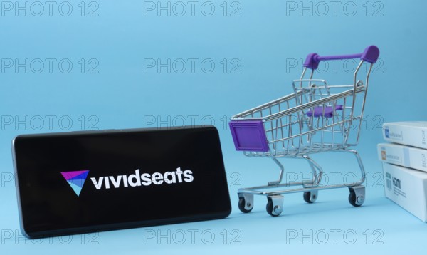 Dhaka, Bangladesh- 03 July 2025: Smartphone with VividSeats logo next to a small shopping cart and