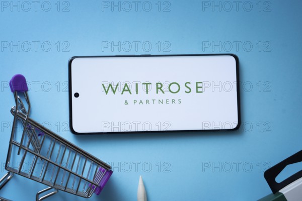 Dhaka, Bangladesh- 03 July 2025: Smartphone displaying Waitrose & Partners logo with shopping cart
