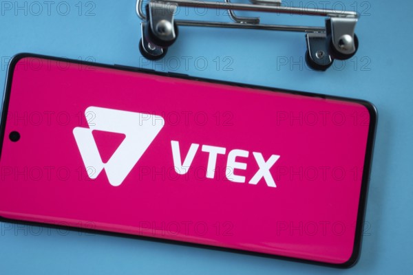 Dhaka, Bangladesh- 03 July 2025: Smartphone screen showing the VTEX logo with shopping cart wheels