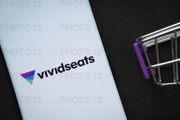 Dhaka, Bangladesh- 03 July 2025: A smartphone displaying the VividSeats logo next to a miniature