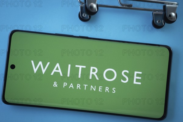 Dhaka, Bangladesh- 03 July 2025: Smartphone screen showing the Waitrose & Partners logo with