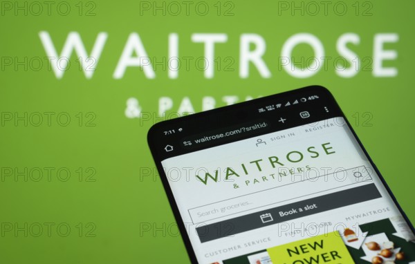Dhaka, Bangladesh- 03 July 2025: Smartphone displaying Waitrose & Partners web interface against (.
