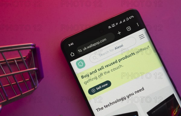 Dhaka, Bangladesh- 23 June 2025: A smartphone displaying the Wallapop website with a shopping cart