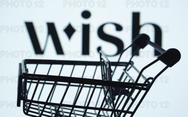 Dhaka, Bangladesh- 03 July 2025: Silhouette of a shopping cart in front of the Wish logo,