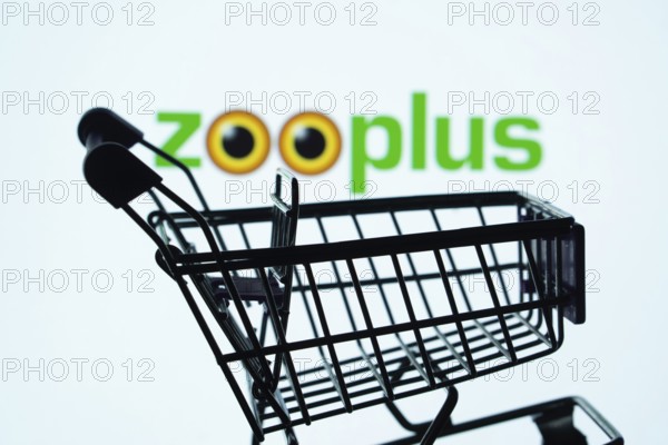 Dhaka, Bangladesh- 03 July 2025: Silhouette of a shopping cart in front of the zooplus logo,