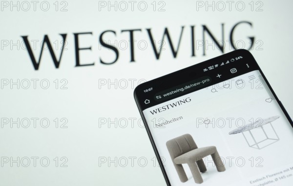 Dhaka, Bangladesh- 03 July 2025: Smartphone displaying Westwing web interface against Westwing logo