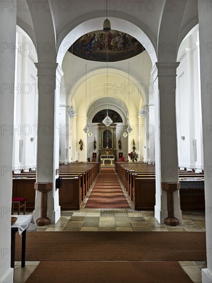 Interior view of a church with altar, arches and wooden pews, Kammersdorf Hollabrunn Weinviertel