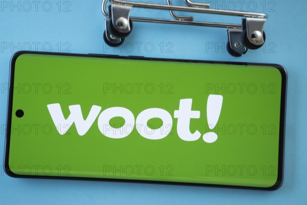 Dhaka, Bangladesh- 03 July 2025: Smartphone screen showing the Woot logo with shopping cart wheels