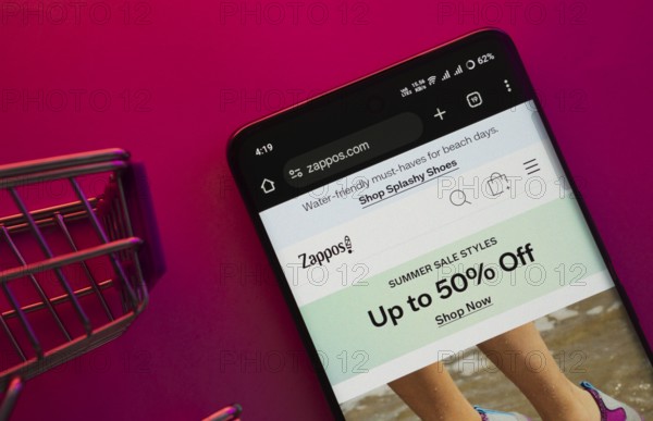 Dhaka, Bangladesh- 23 June 2025: A smartphone displaying the Zappos website with a shopping cart is
