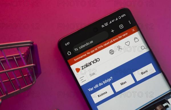 Dhaka, Bangladesh- 23 June 2025: A smartphone displaying the Zalando website with a shopping cart