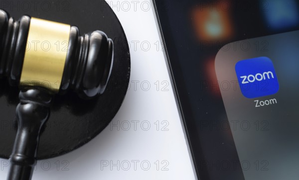 Dhaka, Bangladesh- 18 March 2025: A close up of an iPad screen displaying the zoom app alongside a