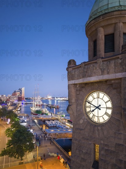 Evening atmosphere at the Landungsbrücken with a view of the Elbphilharmonie and the historic