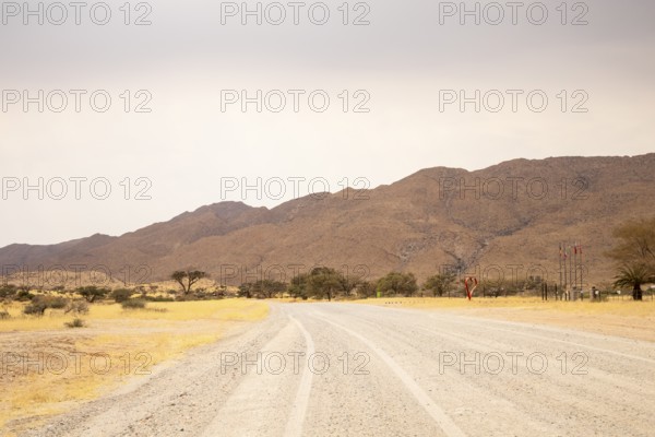 Dirt Road in Solitaire, Namibia, located on the edge of the Namib Desert, surrounded by dunes and