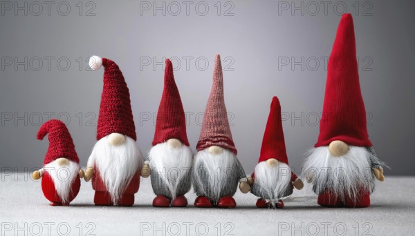Group of christmas gnomes with red hats and white beards standing together on gray background, AI