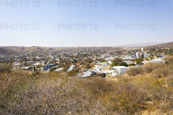 A panoramic view of Windhoek, Namibia, from the National Botanic Garden, showing the city's mix of