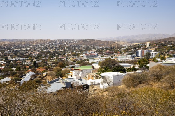 A panoramic view of Windhoek, Namibia, from the National Botanic Garden, showing the city's mix of