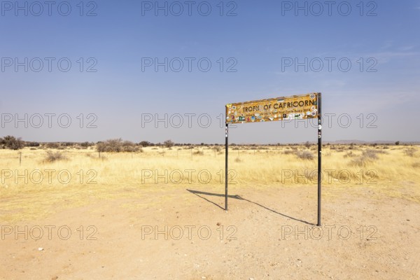 Namibia- 25 August, 2025: Road sign marking the Tropic of Capricorn in Namibia's dry, sandy