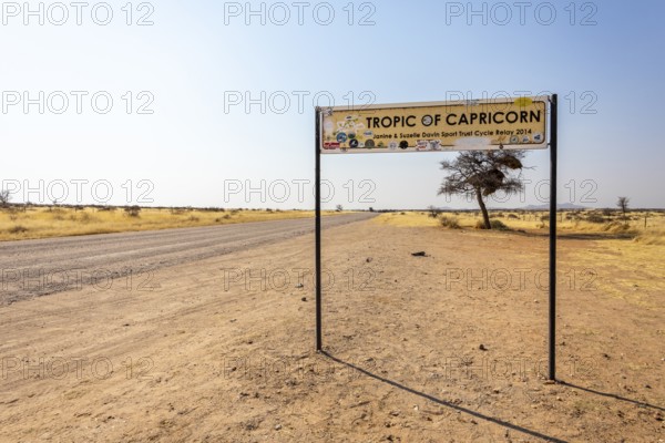 Namibia- 25 August, 2025: Road sign marking the Tropic of Capricorn in Namibia's dry, sandy