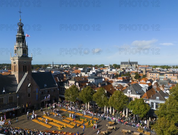 View over town with church and market square, surrounded by historic buildings, aerial view,