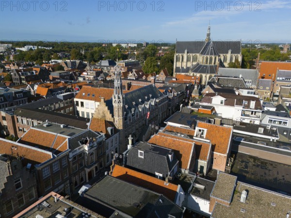 Aerial view of a city with historic buildings and a church under a clear sky, aerial view, town