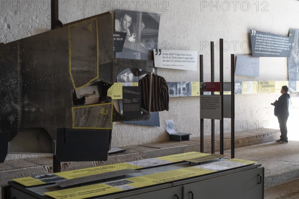 Visitor stands in the documentation centre in the old Engelberg tunnel, first motorway tunnel in