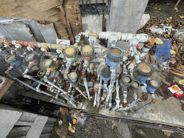 Infrastructure, water pipes and water meters of various houses, San Carlos, Negros Occidental,