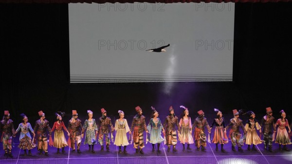 Members of Fire of Anatolia, also known as Anadolu Atesi, bow to the audience after their
