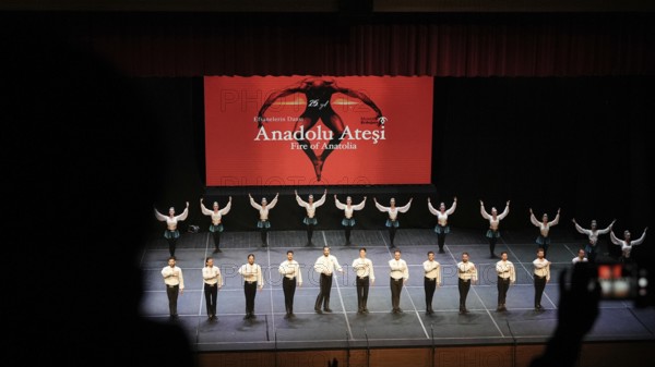 Members of Fire of Anatolia, also known as Anadolu Atesi, bow to the audience after their