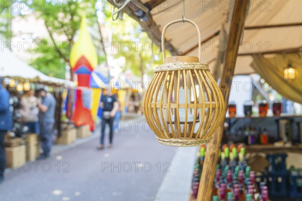 Decorative wooden lantern at a market with colourful stalls, Sindelfingen, Böblingen district,