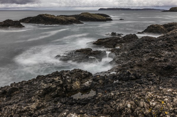 Rocky coast, offshore islands, Ballintoy Harbour, Causeway Coastal Route, Antrim, Northern Ireland,