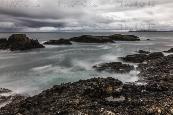 Rocky coast, offshore islands, Ballintoy Harbour, Causeway Coastal Route, Antrim, Northern Ireland,