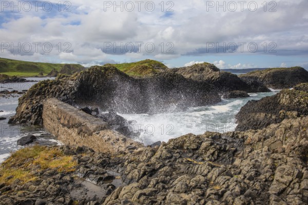 Breakwater at the fishing harbour, Ballintoy Harbour, Causeway Coastal Route, Antrim, Northern
