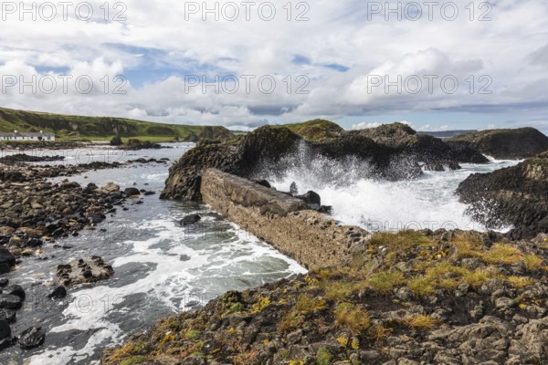 Breakwater at the fishing harbour, Ballintoy Harbour, Causeway Coastal Route, Antrim, Northern