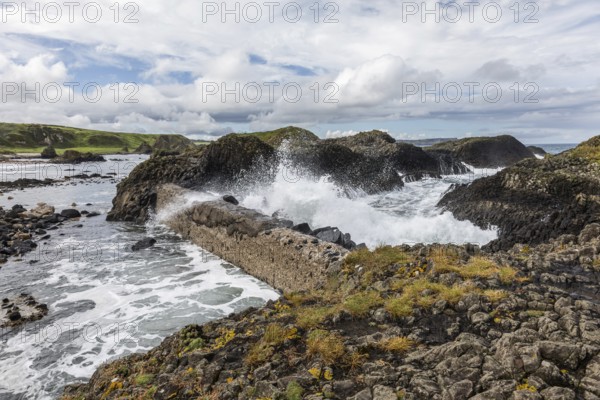 Breakwater at the fishing harbour, Ballintoy Harbour, Causeway Coastal Route, Antrim, Northern