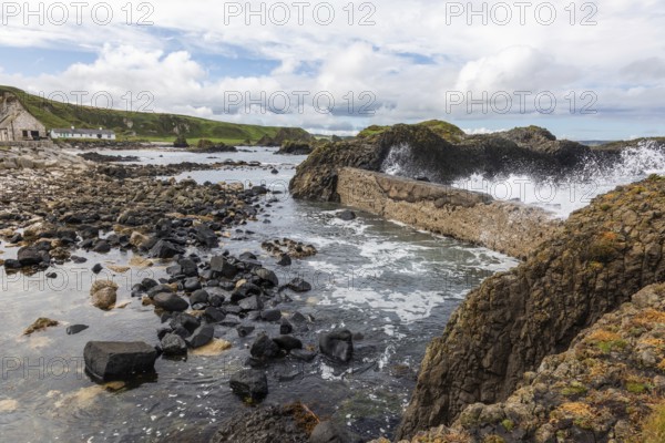 Breakwater at the fishing harbour, Ballintoy Harbour, Causeway Coastal Route, Antrim, Northern