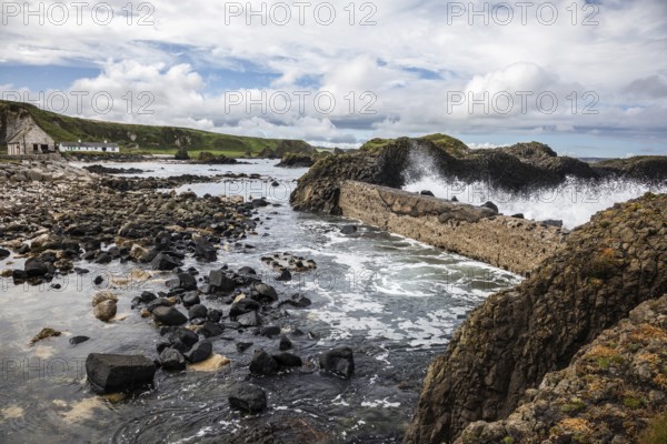 Breakwater at the fishing harbour, Ballintoy Harbour, Causeway Coastal Route, Antrim, Northern