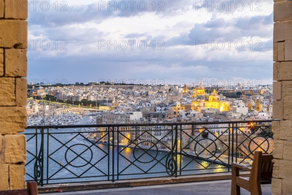 Beautiful evening view of illuminated Valletta, Birgu with Saint Angelo Fortress, capital city of