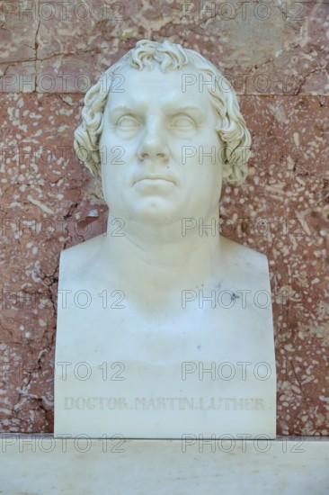 White marble bust of Martin Luther in front of a reddish wall, Walhalla, Donaustauf, Regensburg,