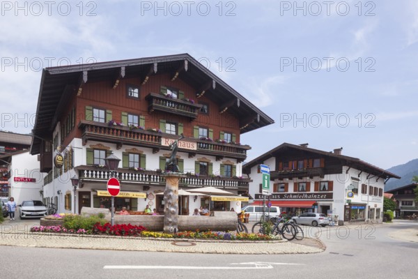Town hall with lumberjack sculpture and catering, Reit im Winkl, Chiemgau, Upper Bavaria, Bavaria,