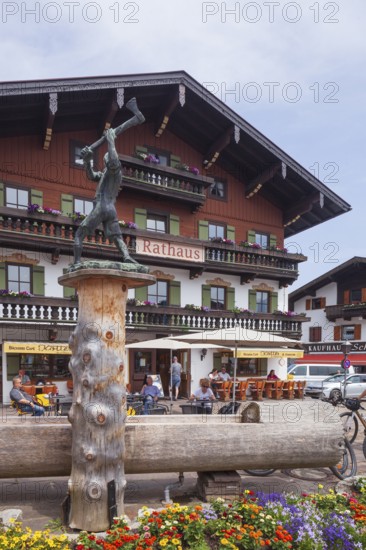 Town hall with lumberjack sculpture and catering, Reit im Winkl, Chiemgau, Upper Bavaria, Bavaria,