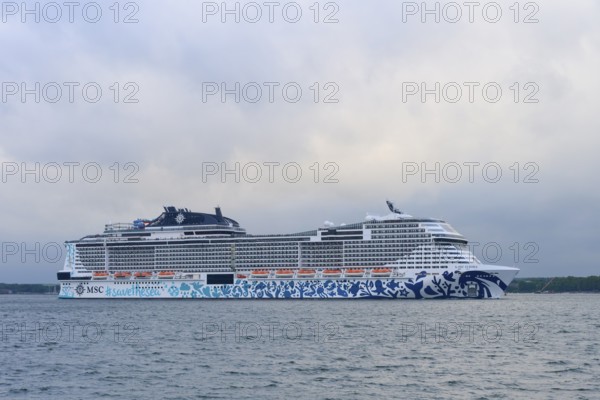 Cruise ship, MSC Euribia, at sea under a cloudy sky, Heikendorf, Plön district, Kiel Fjord,