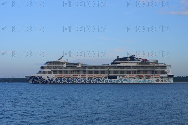Cruise ship, MSC Euribia, sailing through the vastness of the ocean under a blue sky, Heikendorf,