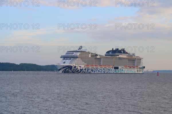 A cruise ship, MSC Euribia, sailing close to the coast across the calm sea, Heikendorf, Plön
