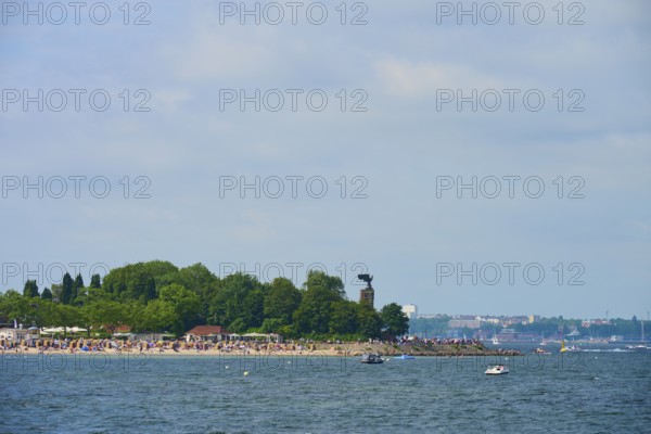 Beach with trees and many visitors by the sea, Heikendorf, Plön district, Kiel Fjord,